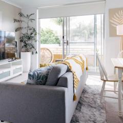 Coastal getaway, tropical palms in Dee Why