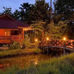 Thai wooden house near the pond Mountain View Chiang mai