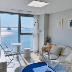 Gwangalli Beachfront House with a beam projector