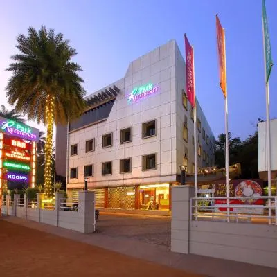 园居酒店，位于科泽科德的酒店