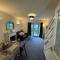Comfy 2-bedroom townhouse featuring a fireplace, private entrance, equipped kitchen, terrace with garden views, washing machine flat-screen TV and sofa bed sleeping 2 additional guests