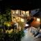 OASIS VILLA Suites & Rooms