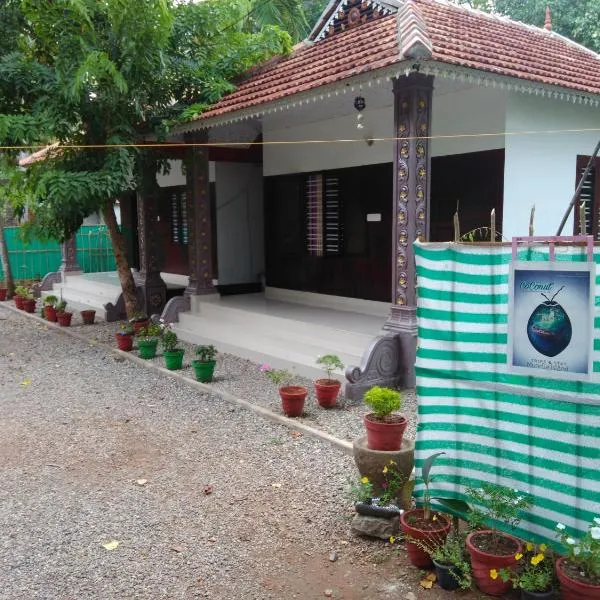 Munroe Coconut Homestay，位于Kottārakara的酒店
