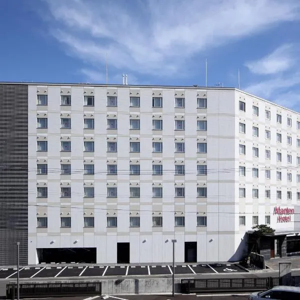 敦贺曼藤站前酒店，位于Nago的酒店