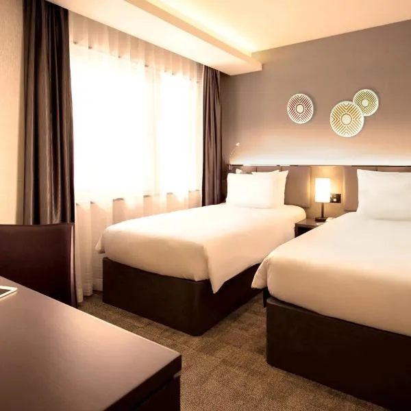 Holiday Inn & Suites Shin Osaka, an IHG Hotel，位于Itami的酒店