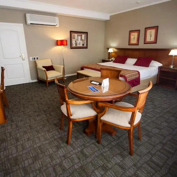 图库曼中心商务套房酒店，位于圣米格尔·德·图库玛的酒店