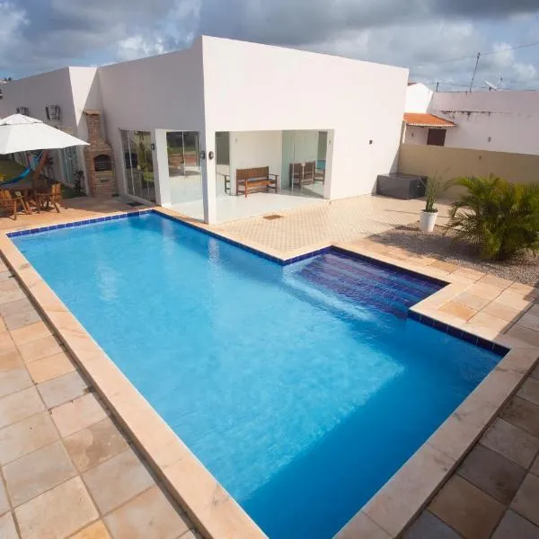 Casa com Piscina e 03 Suítes Paraiso do brasil，位于托鲁斯的酒店