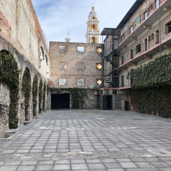 Hostal Casa De Arcos，位于普埃布拉的酒店