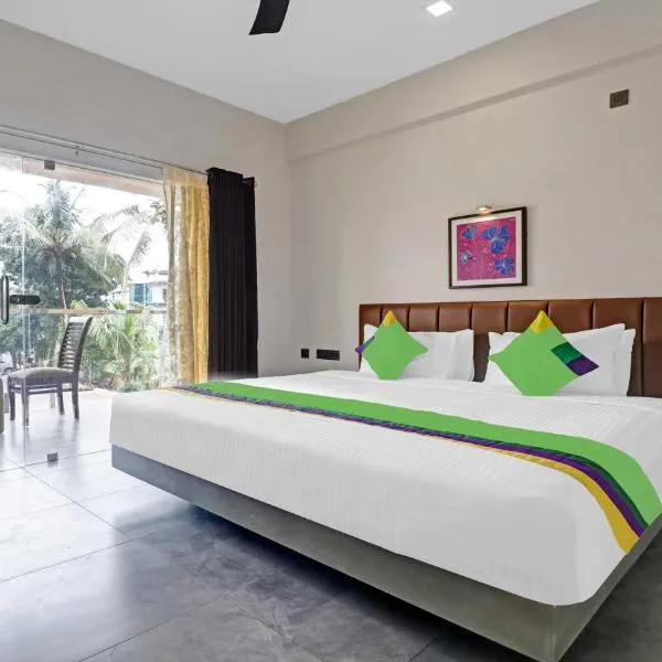 Treebo Grand Vistara Airport Suites，位于安加马尔伊的酒店