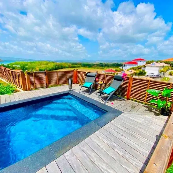 Villa Passion Cannelle de standing avec sa piscine vue mer，位于勒迪亚芒的酒店