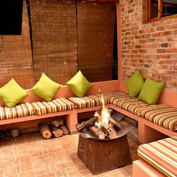 Acogedora Cabaña En Tabio con zonas verdes y BBQ，位于塔比奥的酒店