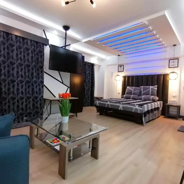 Condo Azur Suites E507 near Airport, Netflix, Stylish, Cozy with swimming pool，位于Liloan的酒店