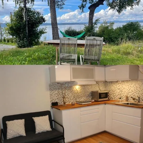 Nice Apartment with1 bedroom Separate living room with a sofa bed and a tiny kitchen a bathroom located in Nordstrand near by the Sea for 3 guests with a garden and grill 5 extra guests with extra cost in the cabin with sea view just outside the apartment，位于科尔博滕的酒店