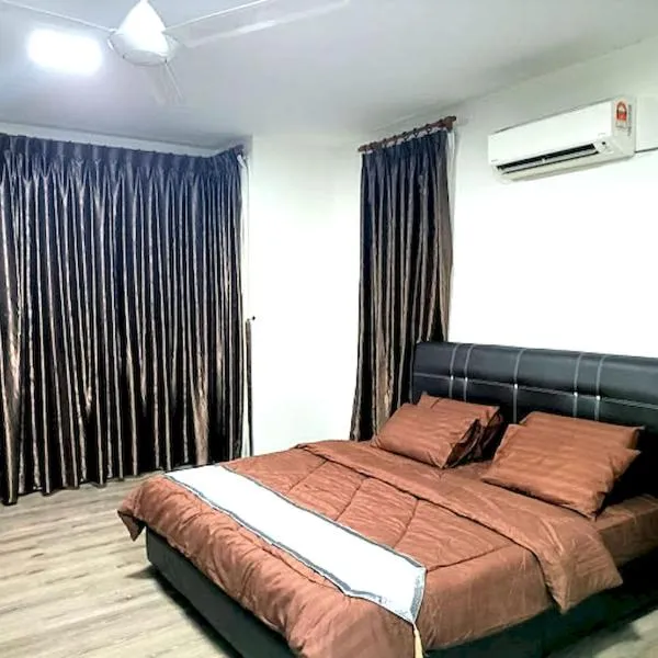 OYO HOME 90768 Flo Inn Motel，位于Kampong Parit的酒店