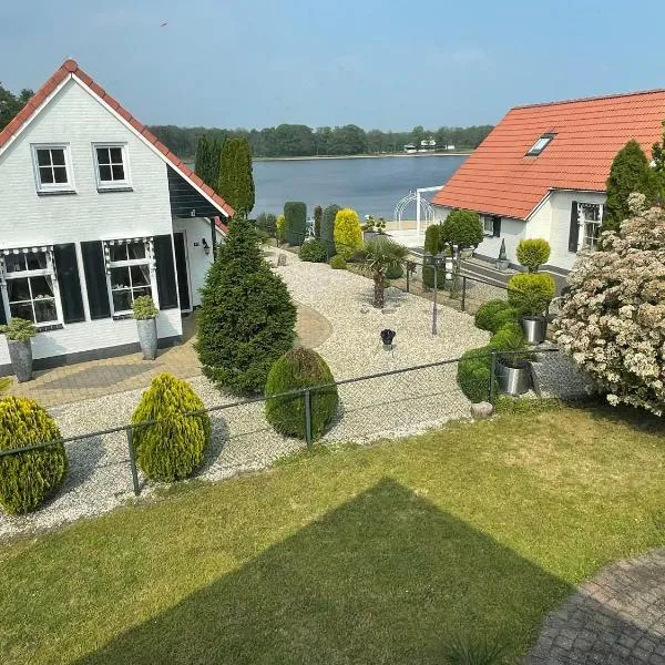 Freistehendes Ferienhaus am See Nähe Roermond，位于Heel的酒店