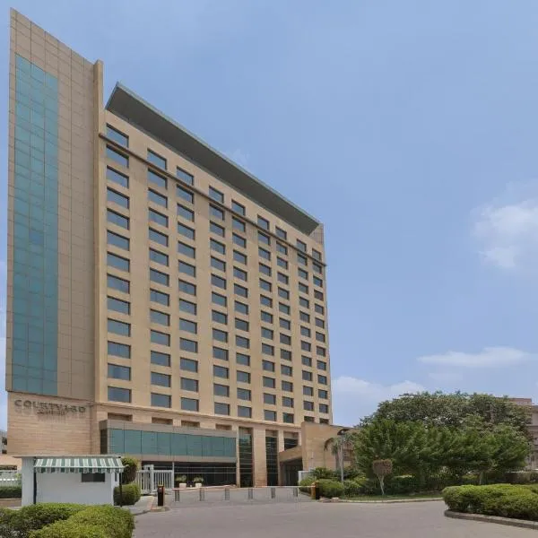 古茹格拉姆市中心万怡酒店，位于Bādshāhpur的酒店