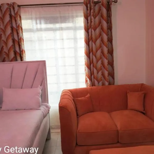 Comfy Getaway STUDIO apartment near JKIA & SGR with KING BED, WIFI, NETFLIX and SECURE PARKING，位于思由基茅的酒店