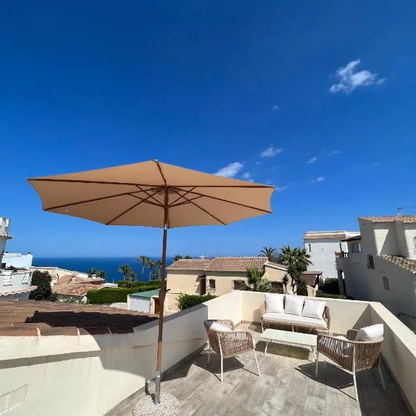 Luminosa villa con vistas al mar en Cala Moraig，位于贝尼塔切利的酒店