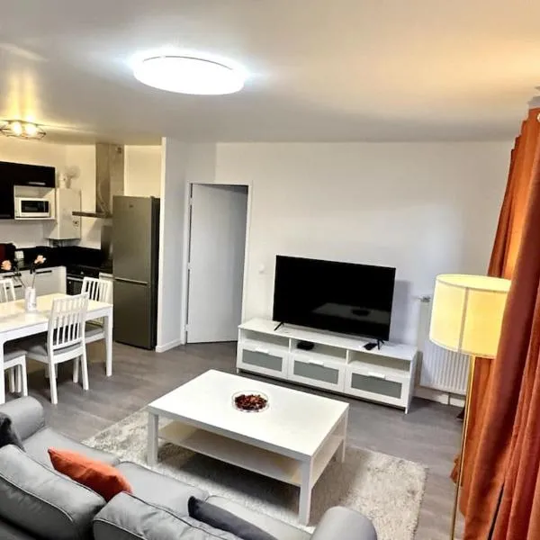 Appartement Cozy - Quartier résidentiel，位于默伦的酒店