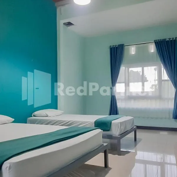 Syariah Safar Guest House Mitra RedDoorz，位于库宁岸的酒店