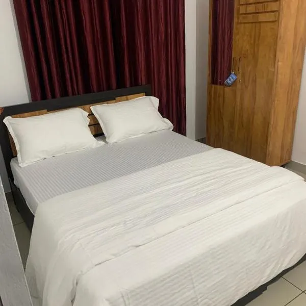 Wayanad Rooms Izza，位于米南加迪的酒店