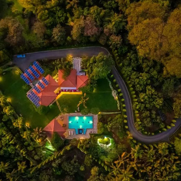 StayVista at Moksh Villa - BBQ & Jacuzzi，位于阿利鲍格的酒店