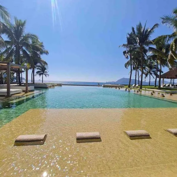 Bonito departamento pie de playa en el mejor condominio de manzanillo, Ponto Horizonte. Hermosa vista, hasta para 8 personas. Ambiente familiar.，位于曼萨尼约的酒店