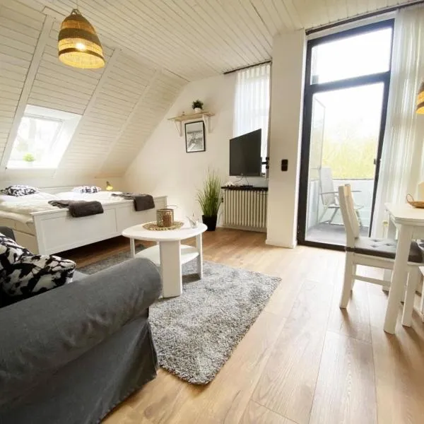 Ferien im Wangerland - Haus Wiesenweg - Apartment 2 1OG，位于霍鲁梅尔希尔的酒店