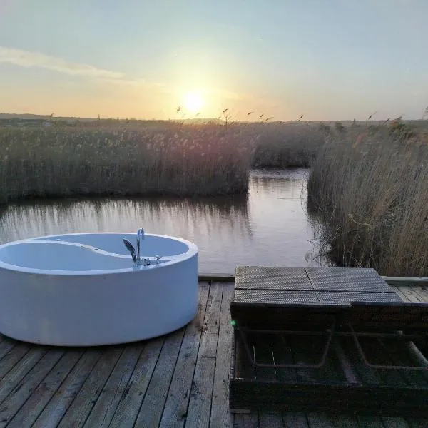 Pfahlbau Sunset II Toplage inklusive Elektroboot，位于拉斯特的酒店