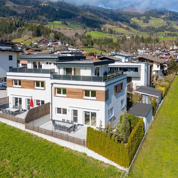 H21 - Modernes Ferienhaus 145qm, 4SZ, Wellnessbereich mit Sauna und Dachterrasse mit Panoramablick, Kühlen und Heizen mit Geothermie，位于菲根的酒店