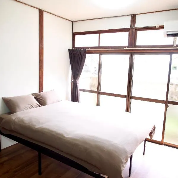 ゲストハウスEn 折尾駅前邸，位于Orio的酒店