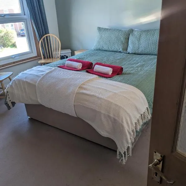 Beach Walk Cottage，位于内兹岬附近沃尔顿的酒店