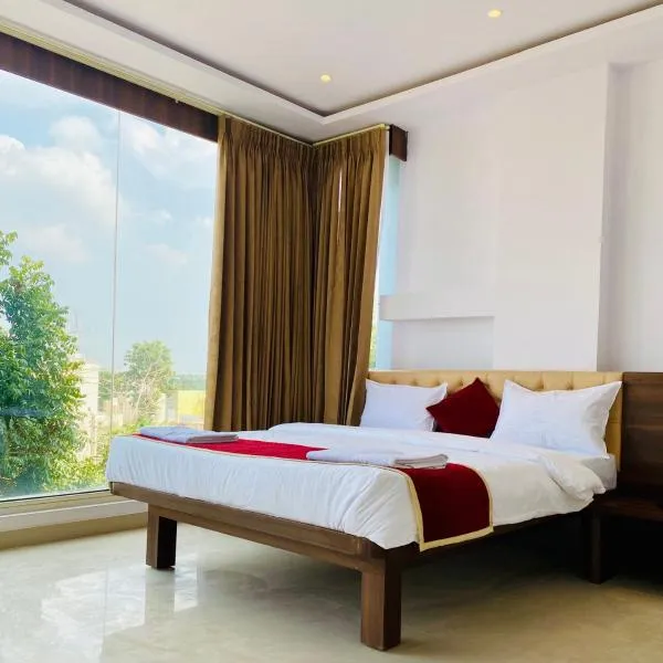 Tulips Inn Mysuru，位于迈索尔的酒店