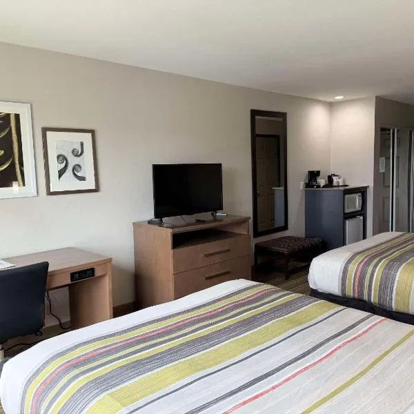 德克萨斯卡尔森哈林根乡村套房酒店，位于哈灵根的酒店