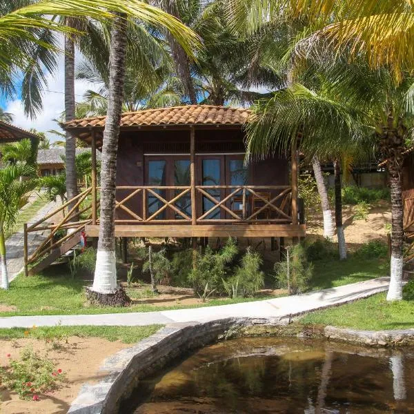 Pousada Palm Beach Praia de Caetanos Chalé Família，位于Amontada的酒店
