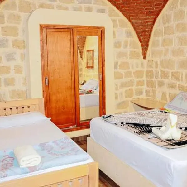 Tebtunis Hotel，位于Qaryat at Ta‘mīr as Siyāḩīyah的酒店