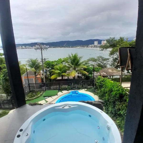 Casamar paraíso na praia com a vista do mar dos sonhos piscina e spa，位于瓜鲁雅的酒店