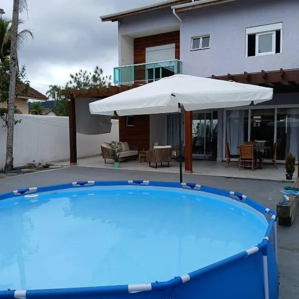 Linda Casa Guarujá enseada 500m da praia，位于瓜鲁雅的酒店