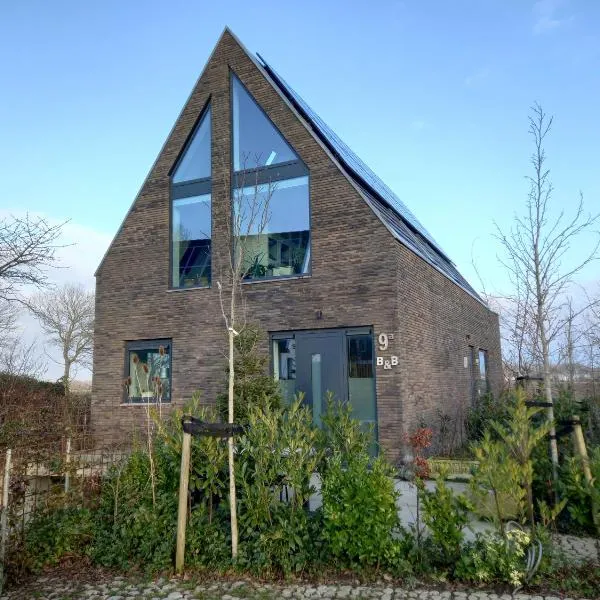 gastenverblijf Bij de Dijk，位于瓦门赫伊曾的酒店
