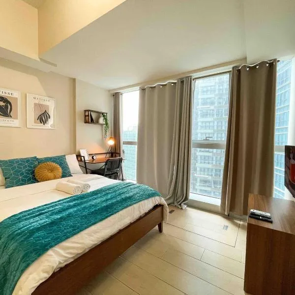 BGC Condo Facing Mitsukoshi Mall #upt122g，位于马尼拉的酒店