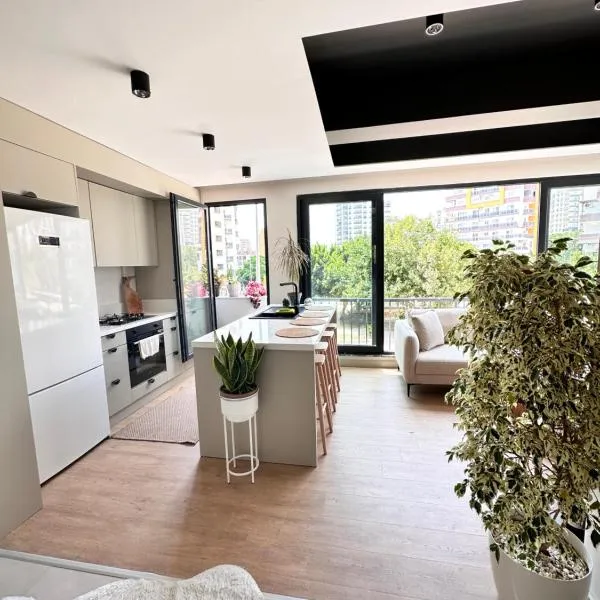 Marina ve sayapark avm yakın iki odalı tasarımlı güzel ev，位于梅尔辛的酒店