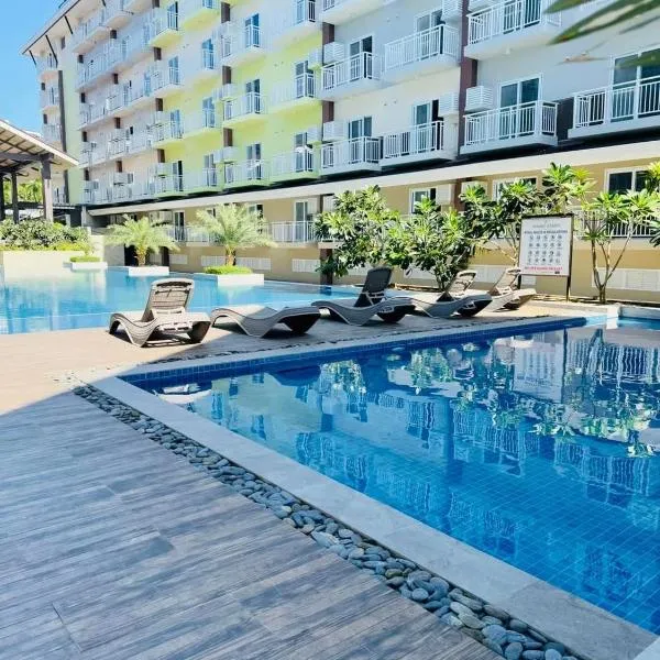 Cozy Staycation Amani Grand Resort Residences Near Cebu Airport with Pool & Gym , Free Wifi，位于Pusok的酒店