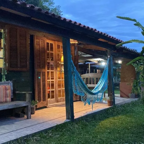 Um Chalé aconchegante no sítio em meio a natureza.，位于维亚芒的酒店