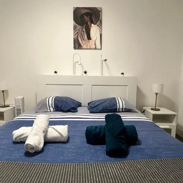 Appartement Cozy - Quartier résidentiel，位于默伦的酒店