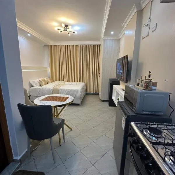 Pamoja stays - Modern studio near transit with balcony and workspace，位于Rungiri的酒店