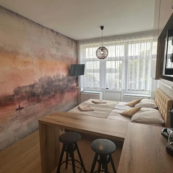 KAMERALNY przy promenadzie - domki, apartamenty, pokoje，位于哈日科维的酒店