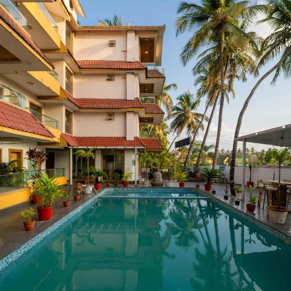 Premium hotel Goa Continental By PerfectStayz，位于阿伯来的酒店