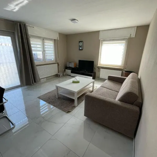 2 Zimmer Holiday Apartment in Karben mit Privatparkplatz-self Check in-15min bis Frankfurt-25min bis Flughafen，位于卡尔本的酒店