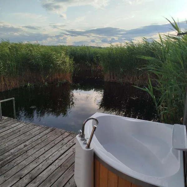Pfahlbau Sunset I Toplage Elektroboot inklusive，位于拉斯特的酒店