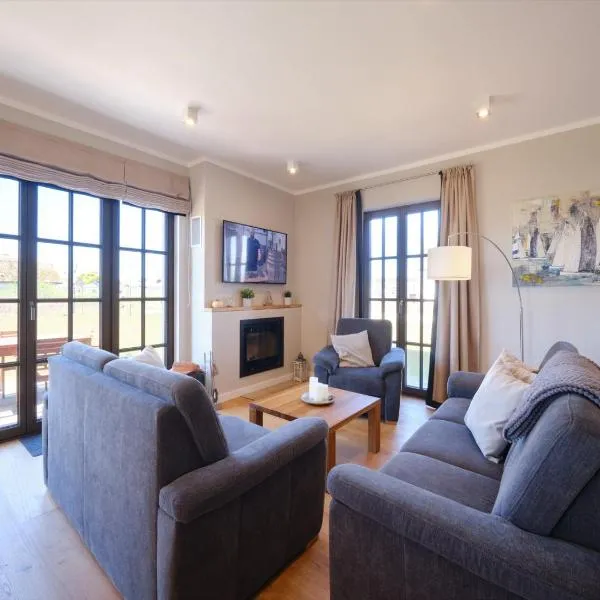 Reetland am Meer - Luxus Reetdachvilla mit 3 Schlafzimmern, Sauna und Kamin H20，位于德兰斯克的酒店